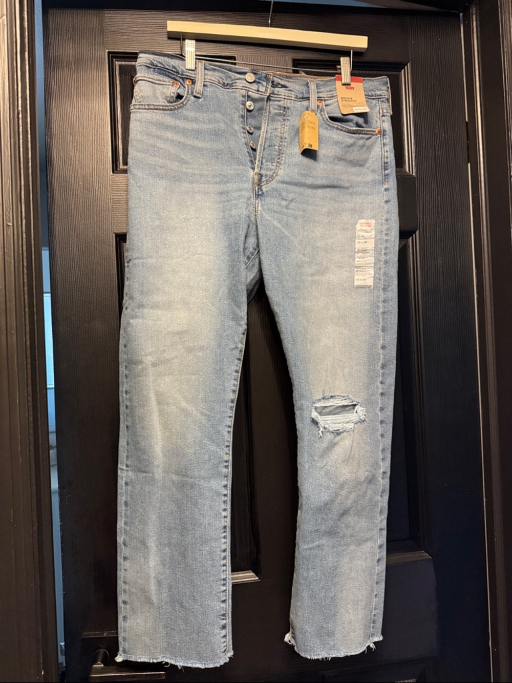 Levi's Light Blue Straight Leg Jeans with Distressed Knee